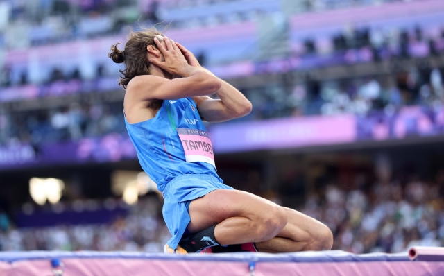 PARIS, FRANCE - AUGUST 10: Gianmarco Tamberi of Team Italy shows his dejection after competing in the Men's High Jump Final on day fifteen of the Olympic Games Paris 2024 at Stade de France on August 10, 2024 in Paris, France. (Photo by Christian Petersen/Getty Images)