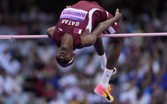 Mutaz Essa Barshim, of Qatar, competes in the men's high jump final at the 2024 Summer Olympics, Saturday, Aug. 10, 2024, in Saint-Denis, France. (AP Photo/Bernat Armangue)