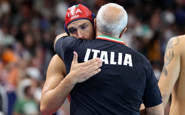 NANTERRE, FRANCE - AUGUST 10: Marco Del Lungo of Team Italy celebrates with Sandro Campagna, Head coach of Team Italy after winning the Men's Classification 7th-8th match between Team Australia and Team Italy on day fifteen of the Olympic Games Paris 2024 at Paris La Defense Arena on August 10, 2024 in Nanterre, France. (Photo by Quinn Rooney/Getty Images)