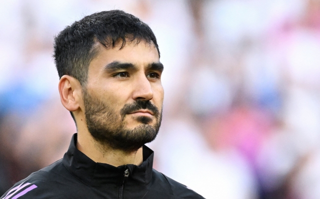 (FILES) Germany's midfielder #21 Ilkay Gundogan is pictured prior to the international friendly football match between Germany and Greece in Moenchengladbach, western Germany, on June 7, 2024. Germany captain Ilkay Gundogan announced his retirement from international football on August 19, 2024 after leading his country at Euro 2024, citing "a certain tiredness" both physically and mentally. (Photo by UWE KRAFT / AFP)