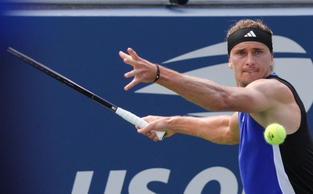 Germany's Alexander Zverev hits a forehand return to Germany's Maximilian Marterer during their men's singles first round tennis match on day one of the US Open tennis tournament at the USTA Billie Jean King National Tennis Center in New York City, on August 26, 2024. (Photo by TIMOTHY A. CLARY / AFP)