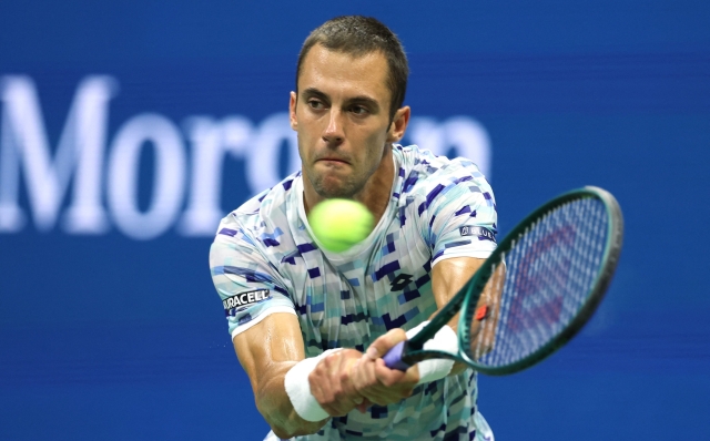 NEW YORK, NEW YORK - AUGUST 28: Laslo Djere of Serbia returns a shot against Novak Djokovic of Serbia during their Men's Singles Second Round match on Day Three of the 2024 US Open at USTA Billie Jean King National Tennis Center on August 28, 2024 in the Flushing neighborhood of the Queens borough of New York City.   Al Bello/Getty Images/AFP (Photo by AL BELLO / GETTY IMAGES NORTH AMERICA / Getty Images via AFP)