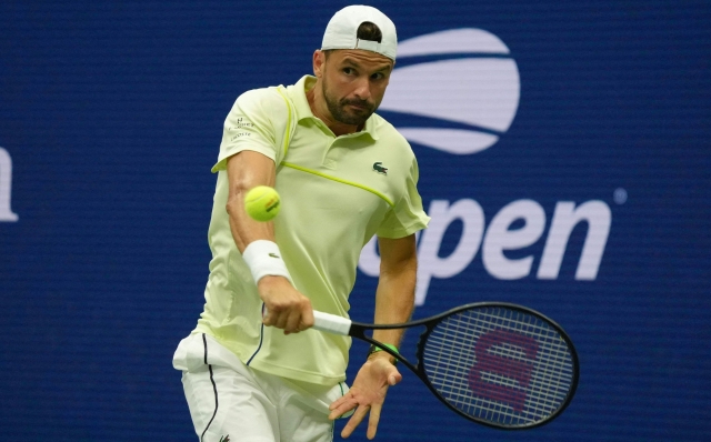 Bulgaria's Grigor Dimitrov plays a return to Russia's Andrey Rublev during their men's singles round of 16 match on day seven of the US Open tennis tournament at the USTA Billie Jean King National Tennis Center in New York City, on September 1, 2024. (Photo by TIMOTHY A. CLARY / AFP)