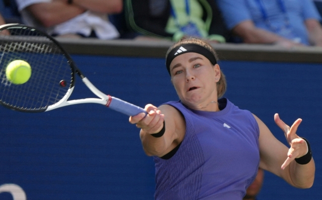 Czech Republic's Karolina Muchova plays a return to Italy's Jasmine Paolini during their women's singles round of 16 match on day eight of the US Open tennis tournament at the USTA Billie Jean King National Tennis Center in New York City, on September 2, 2024. (Photo by TIMOTHY A. CLARY / AFP)