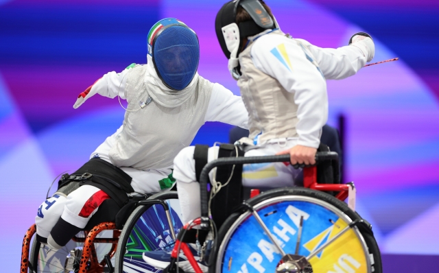 PARIS, FRANCE - SEPTEMBER 04: Beatrice Maria Vio Grandis of Team Italy (L) competes against Nadiia Doloh of Team Ukraine during the Women's Foil Category B Quarterfinal on day seven of the Paris 2024 Summer Paralympic Games at Grand Palais on September 04, 2024 in Paris, France. (Photo by Alex Slitz/Getty Images)