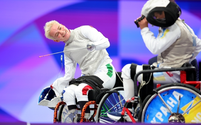 PARIS, FRANCE - SEPTEMBER 04: Beatrice Maria Vio Grandis of Team Italy (L) competes against Nadiia Doloh of Team Ukraine during the Women's Foil Category B Quarterfinal on day seven of the Paris 2024 Summer Paralympic Games at Grand Palais on September 04, 2024 in Paris, France. (Photo by Alex Slitz/Getty Images)