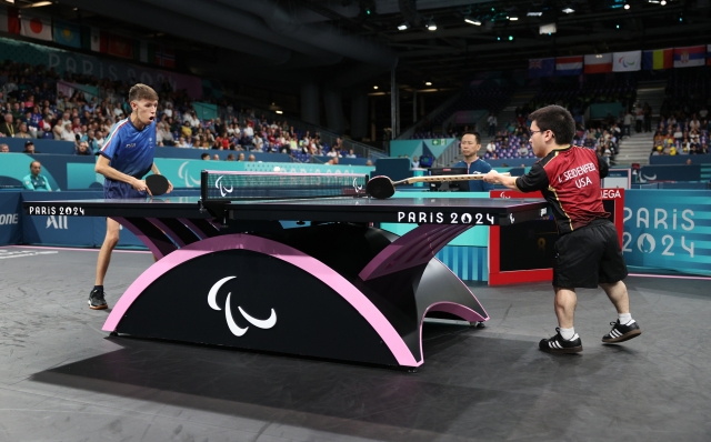 PARIS, FRANCE - SEPTEMBER 05: Ian Seidenfeld of Team United States returns a shot to Matteo Parenzan of Team Italy during their Men's Singles - MS6 - Semifinal 2  on day eight of the Paris 2024 Summer Paralympic Games at South Paris Arena on September 05, 2024 in Paris, France. (Photo by Elsa/Getty Images)