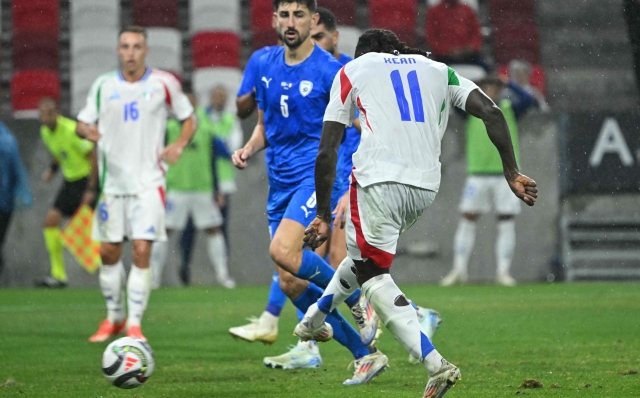 Italy's forward #11 Moise Kean scores the 0-2 goal during the UEFA Nations League, League A, Group A2 football match Israel vs Italy at the Bozsik Arena in Budapest, Hungary, on September 9, 2024. (Photo by Attila KISBENEDEK / AFP)