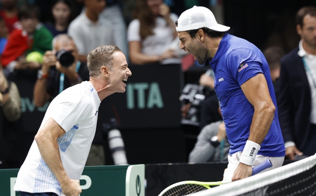 Italian tennis player  Matteo Berrettini  with captain team Filippo Volandri celebrates the victory against Brasilian  player Joao Fonseca  during the match of Davis Cup Final Group Stage at Unipol Arena in Casalecchio (Bologna) Italy, 11 September 2024. ANSA /ELISABETTA BARACCHI