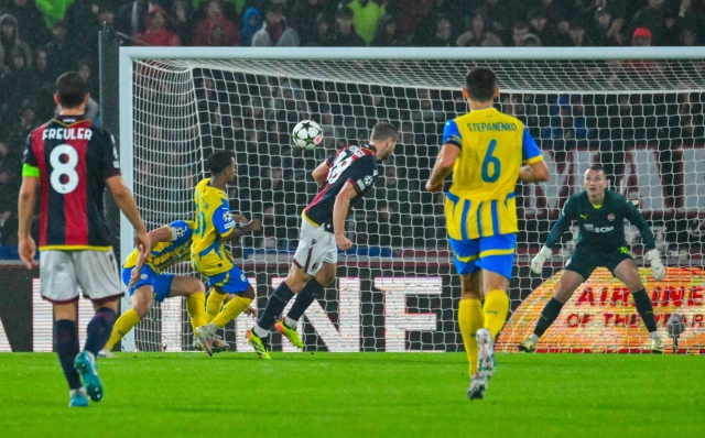 Bologna's Italian midfielder #18 Tommaso Pobega (C) heads the ball and tries to score during the UEFA Champions League 1st round day 1 football match between Bologna FC and Shakthar Donetsk, at the Stadio Renato Dall'Ara in Bologna on September 18, 2024. (Photo by Andreas SOLARO / AFP)