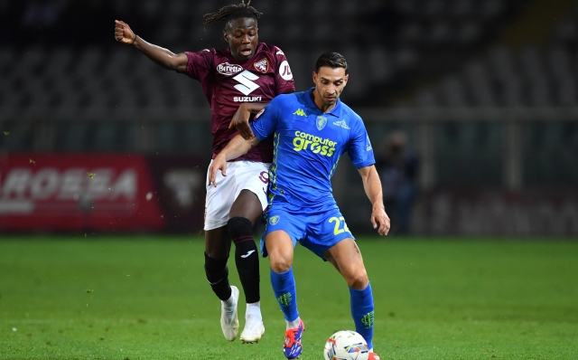 TURIN, ITALY - SEPTEMBER 24: Alieu Eybi Njie of Torino (left) battles for possession with Mattia De Sciglio of Empoli during the Coppa Italia match between Torino FC and Empoli FC at Olimpico Stadium on September 24, 2024 in Turin, Italy. (Photo by Valerio Pennicino/Getty Images)