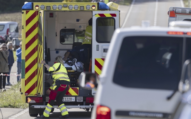 Julian Alaphilippe of France is loaded into the ambulance after a crash during the Men Elite Road Race at the 2024 UCI Road and Para-cycling Road World Championships in Effretikon, Switzerland Sunday, Sept. 29, 2024. (Til Buergy/Keystone via AP)