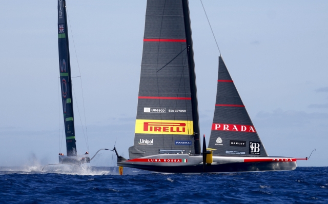 epa11635784 Teams INEOS Britannia (L) and Prada Luna Rossa Pirelli compete during Day 5 in the 2024 Louis Vuitton Cup final in Barcelona, Spain, 01 October 2024. The winner of the Louis Vuitton Cup sailing competition determines the challenger in the 37th America's Cup to be held in October.  EPA/Quique Garcia