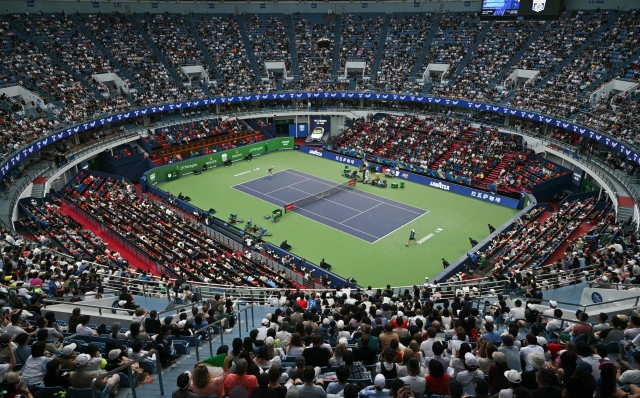 Italy's Jannik Sinner (L) serves to Czech Republic's Tomas Machac during their men's singles semi-final match at the Shanghai Masters tennis tournament in Shanghai on October 12, 2024. (Photo by HECTOR RETAMAL / AFP)