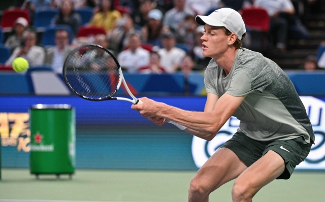 Italy's Jannik Sinner hits a return to Czech Republic's Tomas Machac during their men's singles semi-final match at the Shanghai Masters tennis tournament in Shanghai on October 12, 2024. (Photo by HECTOR RETAMAL / AFP)