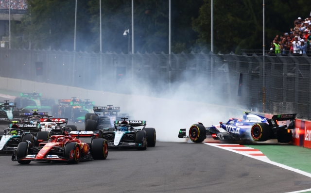 MEXICO CITY, MEXICO - OCTOBER 27: Yuki Tsunoda of Japan driving the (22) Visa Cash App RB VCARB 01 crashes at the start during the F1 Grand Prix of Mexico at Autodromo Hermanos Rodriguez on October 27, 2024 in Mexico City, Mexico. (Photo by Mark Thompson/Getty Images)