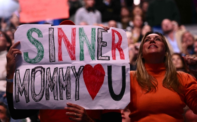 Italy's Jannik Sinner supporters cheer in the stands during his match against USA's Taylor Fritz at the ATP Finals tennis tournament in Turin on November 12, 2024. (Photo by Marco BERTORELLO / AFP)