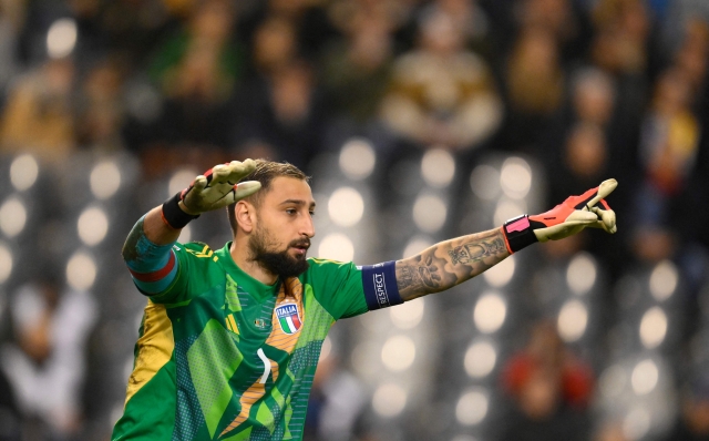 Italy's goalkeeper #01 Gianluigi Donnarumma gestures during the UEFA Nations League Group A2 football match between Belgium and Italy at the King Baudouin Stadium in Brussels on November 14, 2024. (Photo by JOHN THYS / AFP)