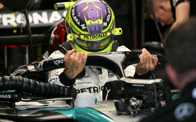 Mercedes' British driver Lewis Hamilton gets in his car for the first practice session of the Qatari Formula One Grand Prix at the Lusail International Circuit in Lusail, north of Doha, on November 29, 2024. (Photo by Andrej ISAKOVIC / AFP)