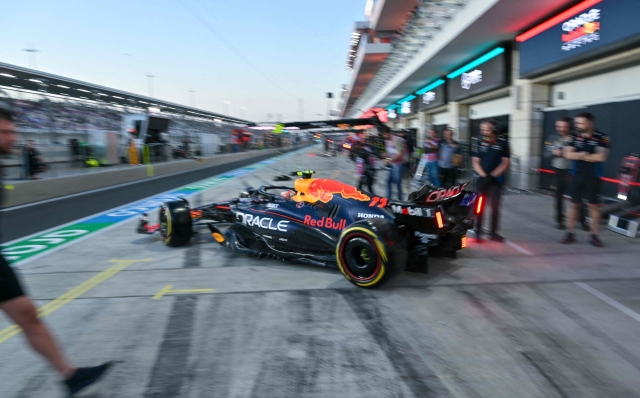 Red Bull Racing's Mexican driver Sergio Perez drives out the garage during the first practice session of the Qatari Formula One Grand Prix at the Lusail International Circuit in Lusail, north of Doha, on November 29, 2024. (Photo by Andrej ISAKOVIC / AFP)