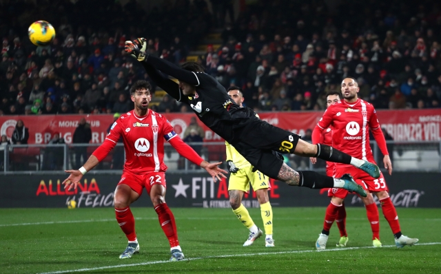 MONZA, ITALY - DECEMBER 22: Stefano Turati of AC Monza clears the ball during the Serie A match between Monza and Juventus at U-Power Stadium on December 22, 2024 in Monza, Italy. (Photo by Marco Luzzani/Getty Images)