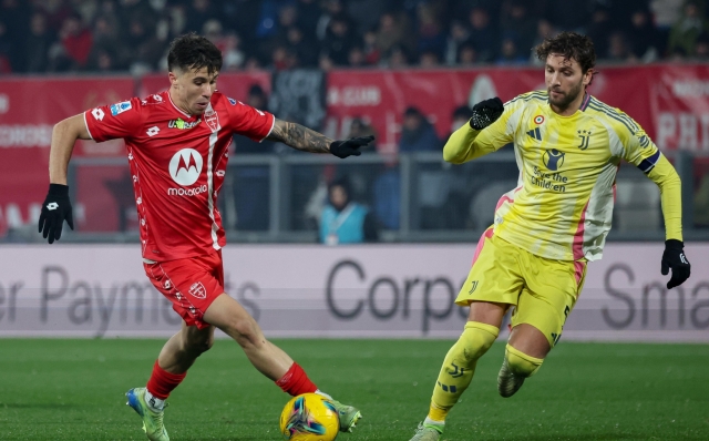 AC Monza's midfielder Alessandro Bianco  in action against Juventus FC's midfielder Manuel Locatelli during the Italian Serie A soccer match between AC Monza and Juventus FC at U-Power Stadium in Monza, Italy, 22 December 2024. ANSA / ROBERTO BREGANI