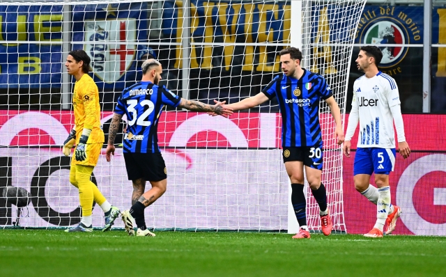 MILAN, ITALY - DECEMBER 23:  Federico Dimarco of FC Internazionale reacts with Carlos Augusto during the Serie A match between FC Internazionale and Como at Stadio Giuseppe Meazza on December 23, 2024 in Milan, Italy. (Photo by Mattia Pistoia - Inter/Inter via Getty Images)