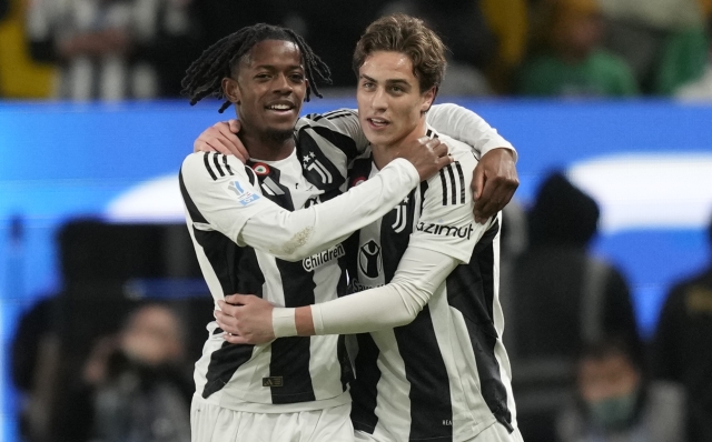 Juventus' Manuel Locatelli-, left, and -Juventus' Kenan Yildiz celebrate after they scored during the Italian Super Cup semifinal soccer match between Juventus and Milan in Riyadh, Saudi Arabia, Friday, Jan. 3, 2025. (AP Photo/Altaf Qadri)