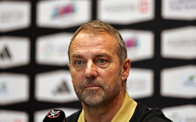 Barcelona's German coach Hans-Dieter Flick attends a press conference in Jeddah on January 11, 2025, on the eve of their Spanish Super Cup final football match against Real Madrid. (Photo by FADEL SENNA / AFP)