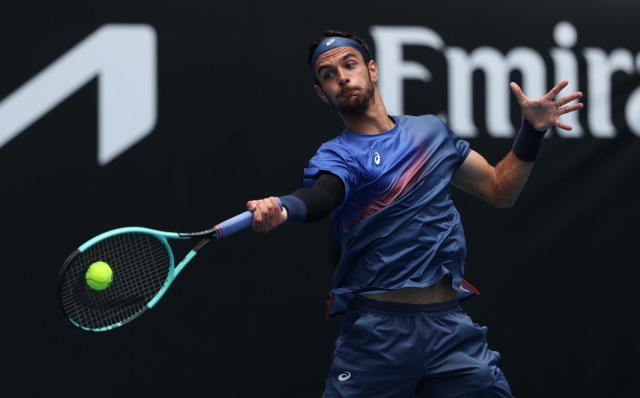 MELBOURNE, AUSTRALIA - JANUARY 16: Lorenzo Musetti of Italy plays a forehand against Denis Shapovalov of Canada in the Men's Singles Second Round match during day five of the 2025 Australian Open at Melbourne Park on January 16, 2025 in Melbourne, Australia. (Photo by Kelly Defina/Getty Images)