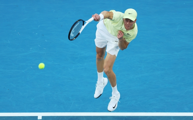 MELBOURNE, AUSTRALIA - JANUARY 18: Jannik Sinner of Italy serves against Marcos Giron of the United States in the Men's Singles Third Round match during day seven of the 2025 Australian Open at Melbourne Park on January 18, 2025 in Melbourne, Australia. (Photo by Clive Brunskill/Getty Images)