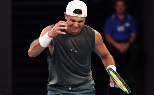 USA?s Marcos Giron reacts on a point against Italy's Jannik Sinner during their men's singles match on day seven of the Australian Open tennis tournament in Melbourne on January 18, 2025. (Photo by DAVID GRAY / AFP) / -- IMAGE RESTRICTED TO EDITORIAL USE - STRICTLY NO COMMERCIAL USE --