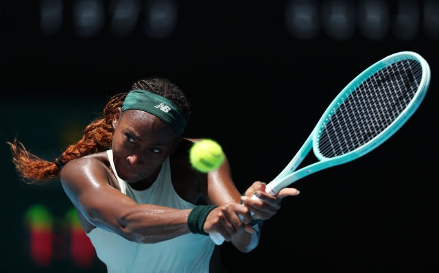 MELBOURNE, AUSTRALIA - JANUARY 21: Coco Gauff of the United States plays a backhand against Paula Badosa of Spain in the Women's Singles Quarterfinal match during day 10 of the 2025 Australian Open at Melbourne Park on January 21, 2025 in Melbourne, Australia. (Photo by Clive Brunskill/Getty Images)