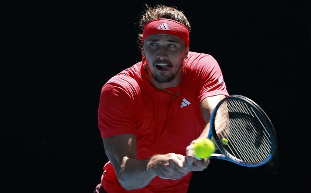 MELBOURNE, AUSTRALIA - JANUARY 21: Alexander Zverev of Germany plays a backhand against Tommy Paul of the United States in the Men's Singles Quarterfinal match during day 10 of the 2025 Australian Open at Melbourne Park on January 21, 2025 in Melbourne, Australia. (Photo by Darrian Traynor/Getty Images)