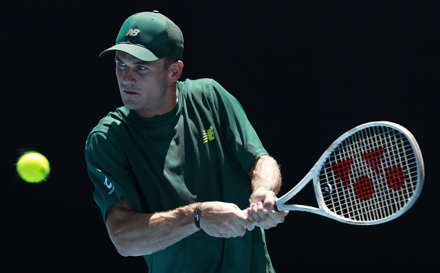 MELBOURNE, AUSTRALIA - JANUARY 21: Tommy Paul of the United States plays a backhand against Alexander Zverev of Germany in the Men's Singles Quarterfinal during day 10 of the 2025 Australian Open at Melbourne Park on January 21, 2025 in Melbourne, Australia. (Photo by Darrian Traynor/Getty Images)