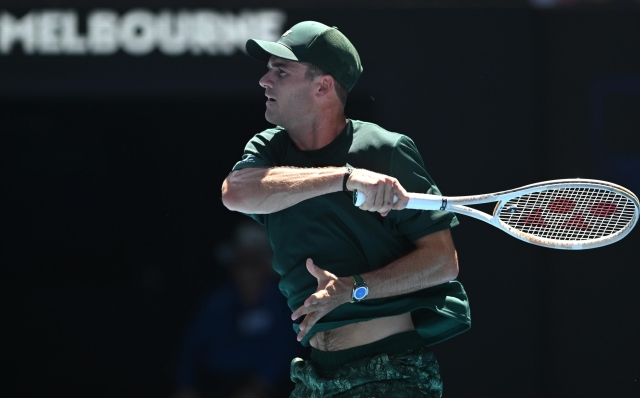 epa11840979 Tommy Paul of the US in action against Alexander Zverev of Germany during their quarter final match during the Australian Open tennis tournament at Melbourne Park in Melbourne, Australia, 21 January 2025.  EPA/LUKAS COCH  AUSTRALIA AND NEW ZEALAND OUT