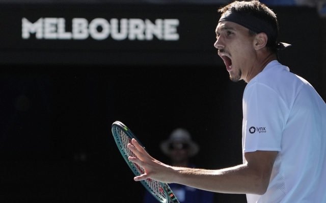 Lorenzo Sonego of Italy reacts during his quarterfinal match against Ben Shelton of the U.S. at the Australian Open tennis championship in Melbourne, Australia, Wednesday, Jan. 22, 2025. (AP Photo/Asanka Brendon Ratnayake)