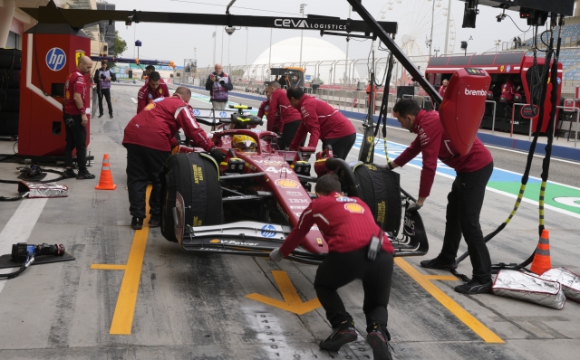 Ferrari driver Lewis Hamilton of Britain makes a pit stop during a Formula One pre-season test at the Bahrain International Circuit in Sakhir, Bahrain, Thursday, Feb. 27, 2025. (AP Photo/Darko Bandic)