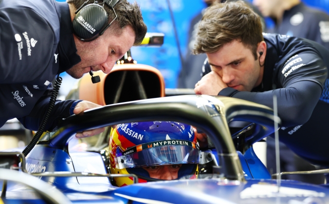 BAHRAIN, BAHRAIN - FEBRUARY 27: Carlos Sainz of Spain and Williams talks with his engineer in the garage during day two of F1 Testing at Bahrain International Circuit on February 27, 2025 in Bahrain, Bahrain. (Photo by Clive Rose/Getty Images)