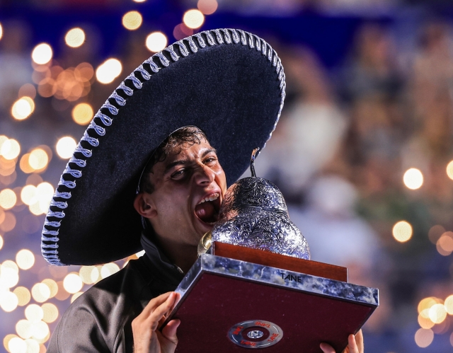 epa12786406 Tennis player Flaio Cobolli poses with the champion trophy after he defeated American Frances Tiafoe to win Mexican Open tennis tournament in Acapulco, Mexico, 28 February 2026 (Issued on 01 March 2026).  EPA/David Guzman