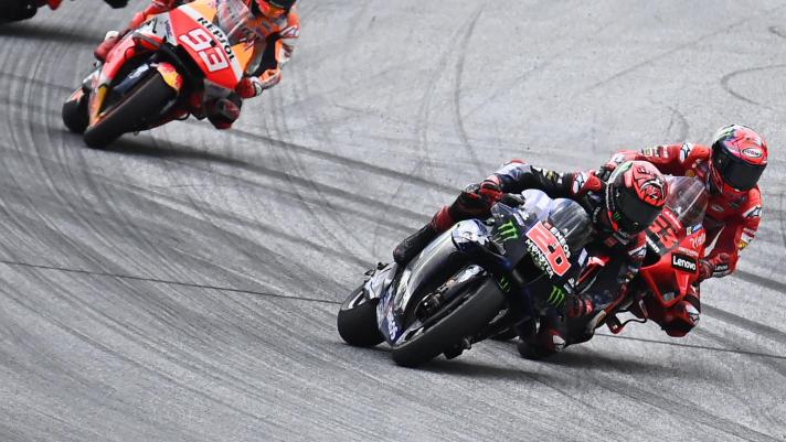 (L-R) Honda Spanish rider Marc Marquez, Yamaha French rider Fabio Quartararo and Ducati Italian rider Francesco Bagnaia compete during the Austrian Motorcycle Grand Prix at the Red Bull Ring race track in Spielberg, Austria on August 15, 2021. (Photo by Joe Klamar / AFP)