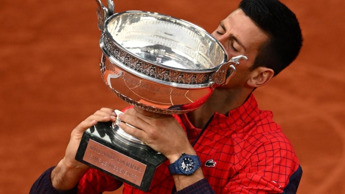 PARIS, FRANCE - JUNE 11: Novak Djokovic of Serbia kisses the winners trophy after victory against Casper Ruud of Norway in the Men's Singles Final match on Day Fifteen of the 2023 French Open at Roland Garros on June 11, 2023 in Paris, France. (Photo by Clive Mason/Getty Images)