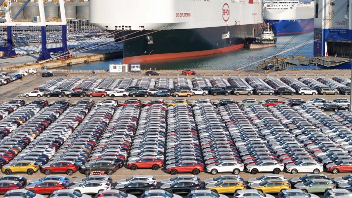 The photo taken on January 10, 2024 shows electric cars for export waiting to be loaded on the "BYD Explorer NO.1", a domestically manufactured vessel intended to export Chinese automobiles, at Yantai port, in eastern China's Shandong province. (Photo by AFP) / China OUT
