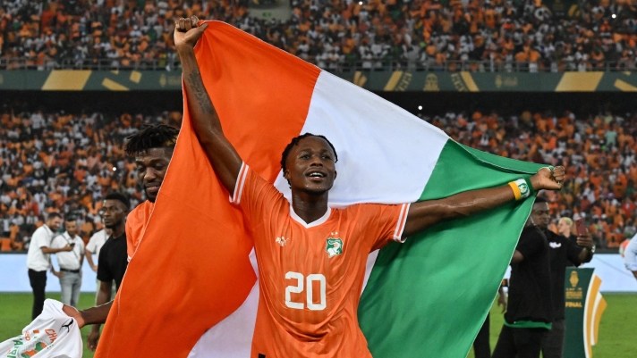 Ivory Coast's forward #20 Christian Kouame celebrates after Ivory Coast won the Africa Cup of Nations (CAN) 2024 final football match between Ivory Coast and Nigeria at Alassane Ouattara Olympic Stadium in Ebimpe, Abidjan on February 11, 2024. (Photo by Issouf SANOGO / AFP)