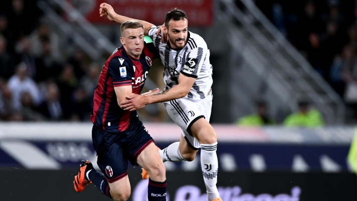 BOLOGNA, ITALY - APRIL 30: Federico Gatti of Juventus battles for the ball with Lewis Ferguson of Bologna FC during the Serie A match between Bologna FC and Juventus at Stadio Renato Dall'Ara on April 30, 2023 in Bologna, Italy. (Photo by Daniele Badolato - Juventus FC/Juventus FC via Getty Images)