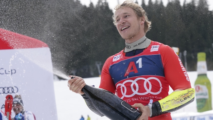 The winner Switzerland's Marco Odermatt celebrates after an alpine ski, men's World Cup giant slalom race, in Bansko, Bulgaria, Saturday, Feb. 10, 2024. (AP Photo/Giovanni Auletta)
