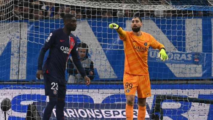 Paris Saint-Germain's Italian goalkeeper #99 Gianluigi Donnarumma gestures to teammates  during the French L1 football match between Olympique Marseille (OM) and Paris Saint-Germain (PSG) at Stade Velodrome in Marseille, southeastern France, on March 31, 2024. (Photo by NICOLAS TUCAT / AFP)