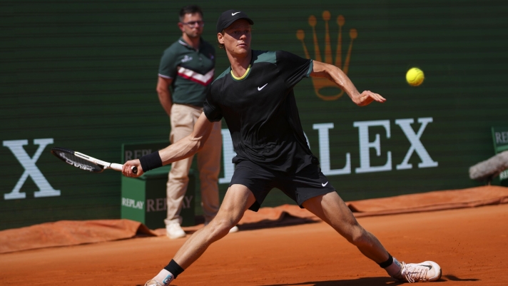 Jannik Sinner, of Italy returns the ball to Stefanos Tsitsipas, of Greece during their Monte Carlo Tennis Masters semifinal match in Monaco, Saturday, April 13, 2024. (AP Photo/Daniel Cole)