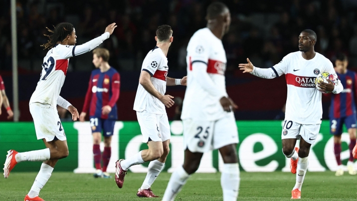 Paris Saint-Germain's French forward #10 Ousmane Dembele celebrates after scoring his team's first goal during the UEFA Champions League quarter-final second leg football match between FC Barcelona and Paris SG at the Estadi Olimpic Lluis Companys in Barcelona on April 16, 2024. (Photo by FRANCK FIFE / AFP)