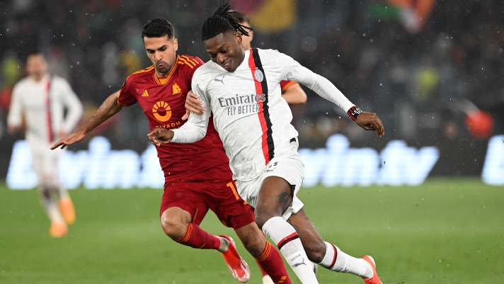 ROME, ITALY - APRIL 18: Rafael Leao of AC Milan battles for possession with Zeki Celik of AS Roma during the UEFA Europa League 2023/24 Quarter-Final second leg match between AS Roma and AC Milan at Stadio Olimpico on April 18, 2024 in Rome, Italy. (Photo by Francesco Pecoraro - AC Milan/AC Milan via Getty Images)